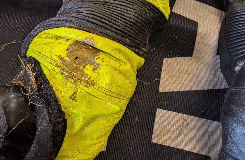 Leathers First race suit elbow abrasion after a track crash, no tear through the leather